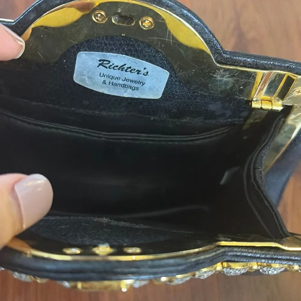 Richters Black leather vintage clutch with rhinestone detail